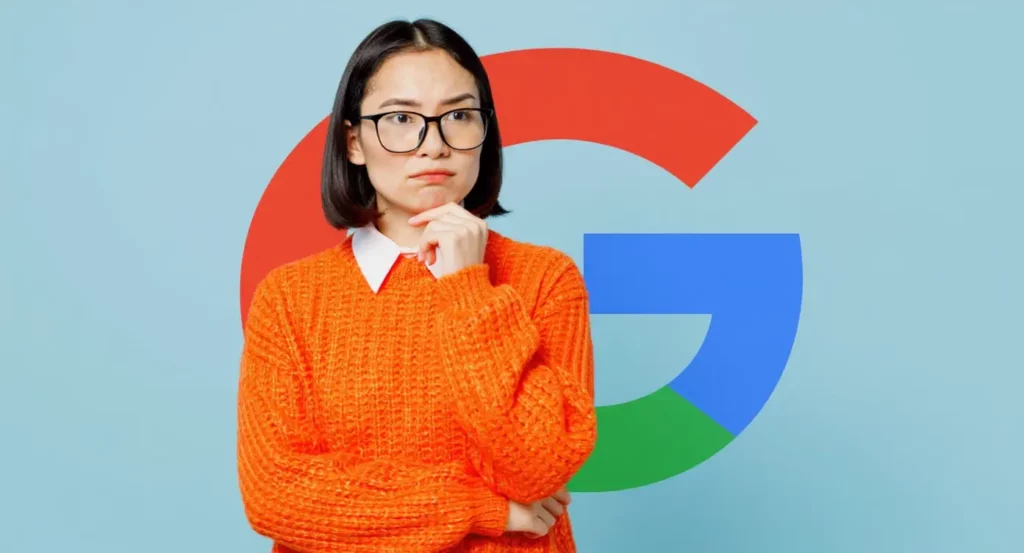 Femmes en pull orange pensant, avec le logo Google en arrière-plan, symbolisant l'innovation et la technologie.