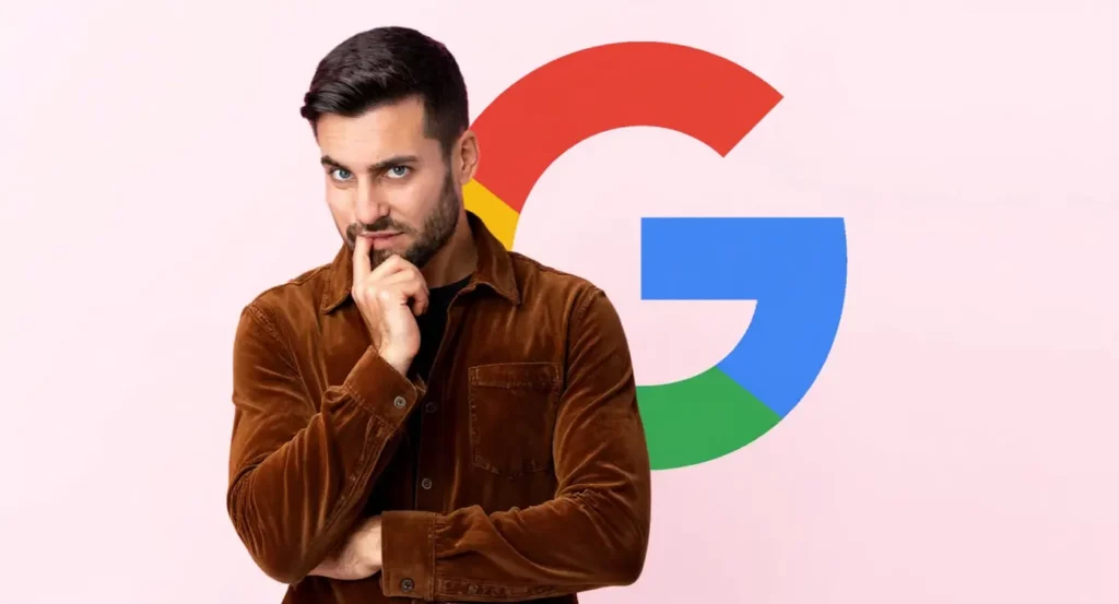Homme pensif en chemise marron devant le logo coloré de Google sur fond rose.