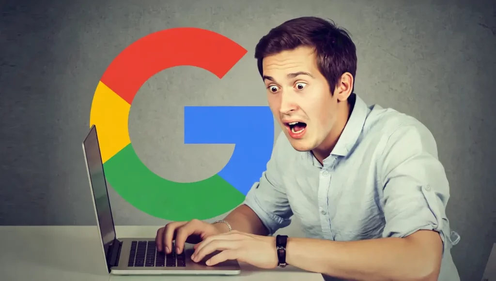 Homme surpris devant un ordinateur portable avec le logo Google en arrière-plan, évoquant l'angoisse digitale.
