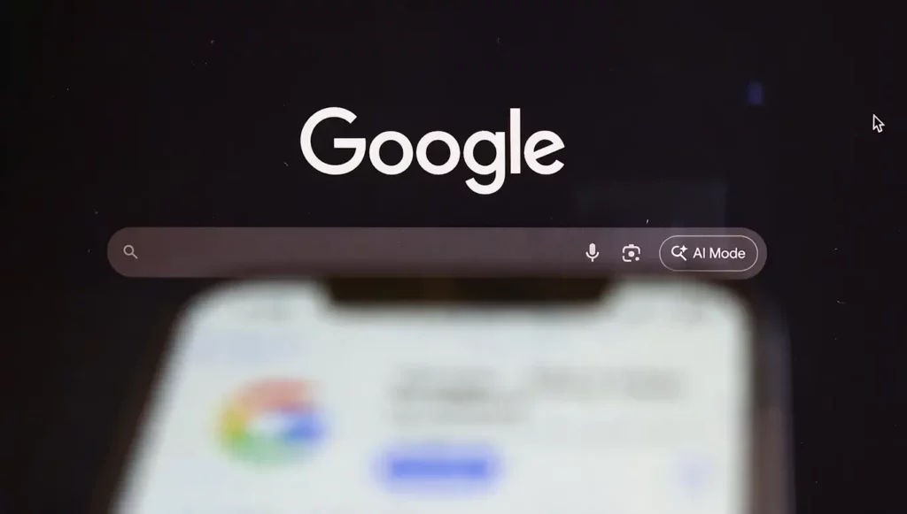 Logo de Google avec une barre de recherche et des icônes pour la recherche vocale et le mode IA.